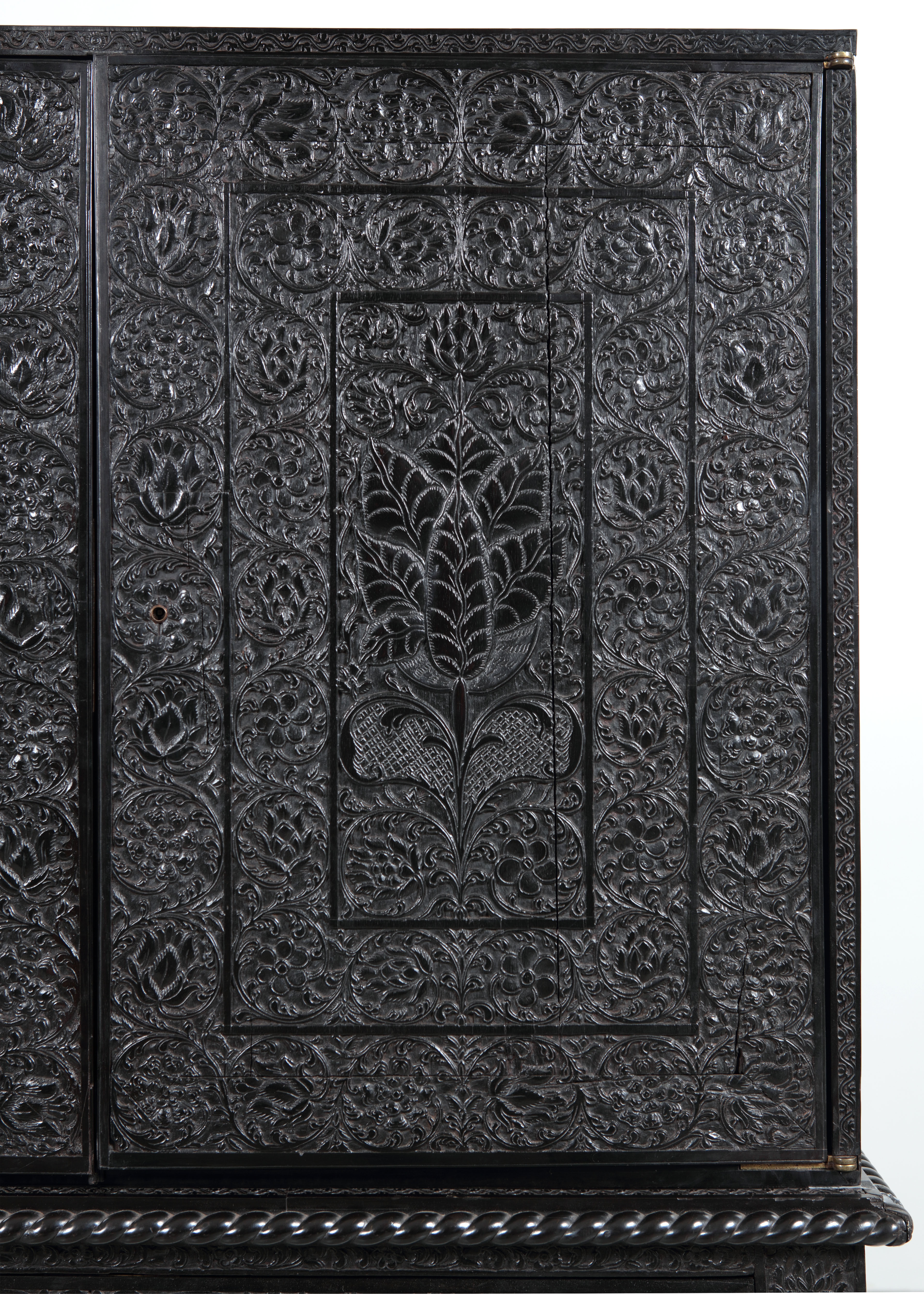 Fine carving on a large cabinet from the Coromandel Coast sold by us 